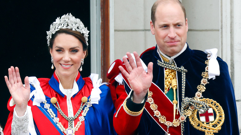 Princess Catherine and Prince William waving at a crowd