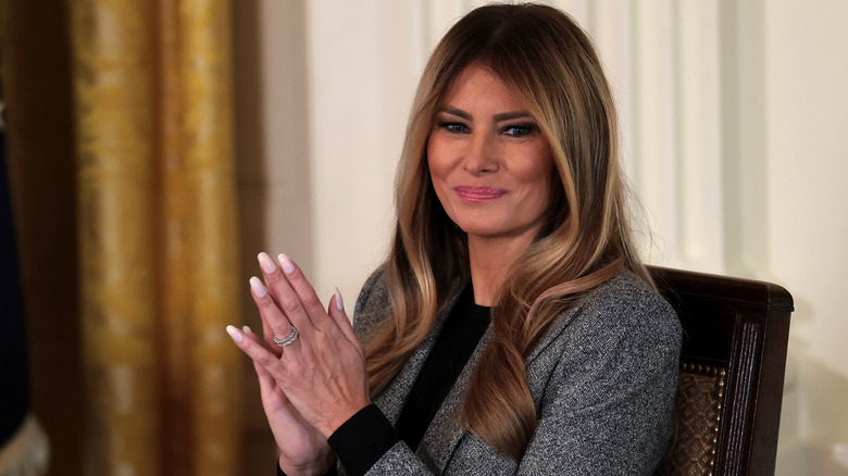 Melania Trump smiling while applauding
