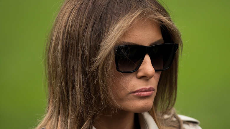 Melania Trump wearing big sunglasses and looking serious