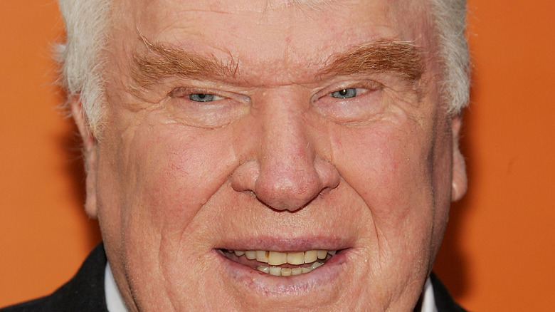 John Madden smiles on the red carpet