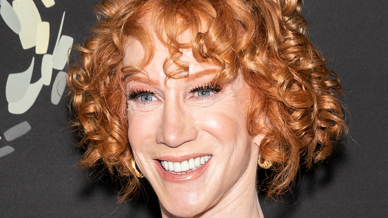 Kathy Griffin smiling with her fist raised 