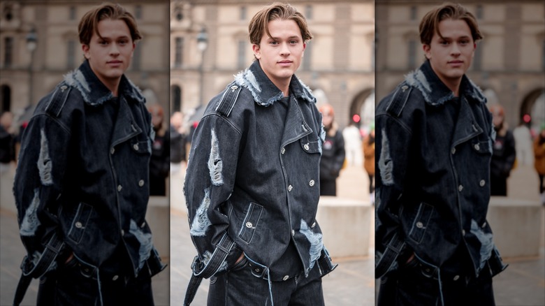 Deacon Phillippe in a fashionably-torn jacket at Paris Fashion Week