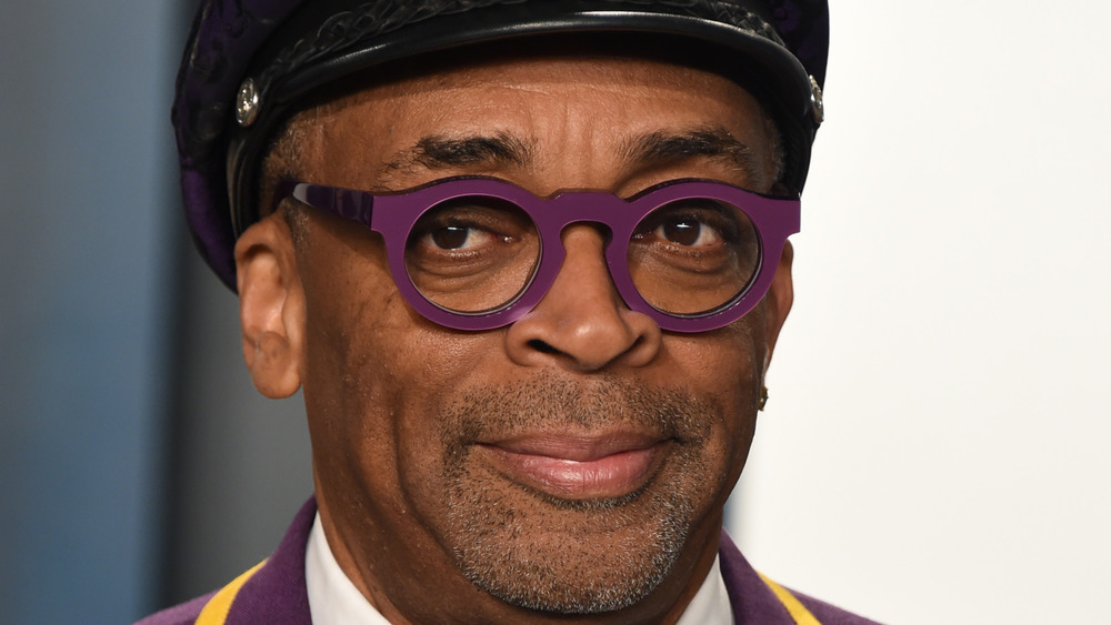 Spike Lee posing, purple glasses