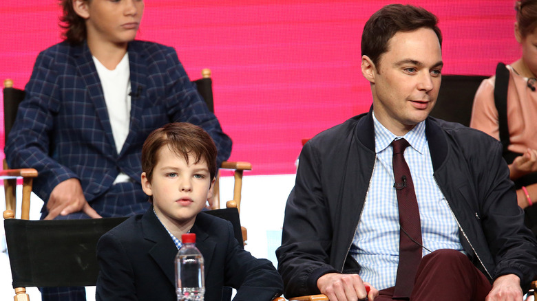 Iain Armitage sitting beside Jim Parsons at a panel