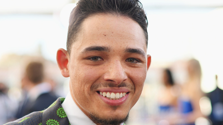 Anthony Ramos smiles for the camera