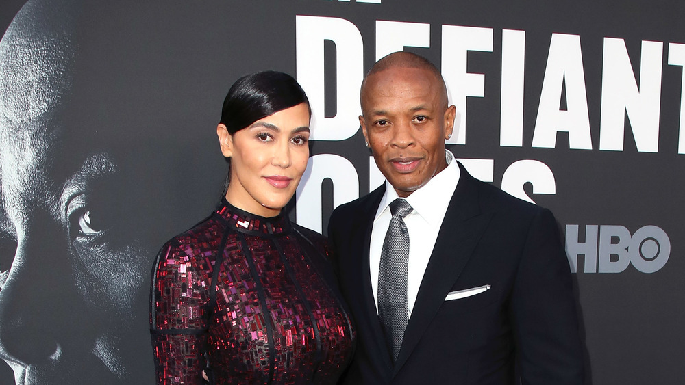 Nicole Young and Dr. Dre in suit and gown