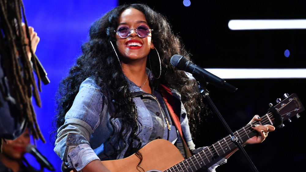 H.E.R. smiling