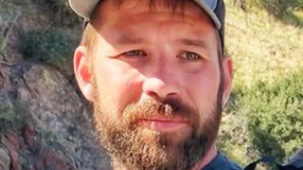 Dr. Cody Creelman in baseball hat with beard