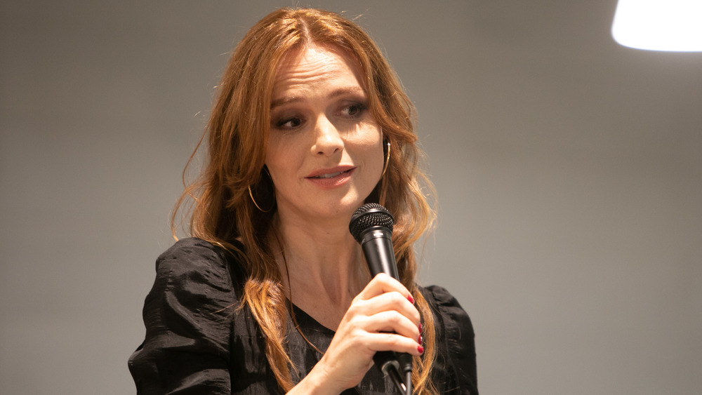 Saffron Burrows speaking into a mic