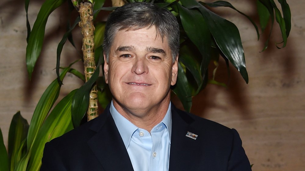 Sean Hannity posing at a press event