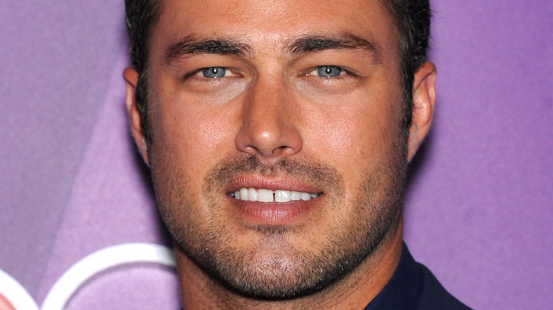 Taylor Kinney posing