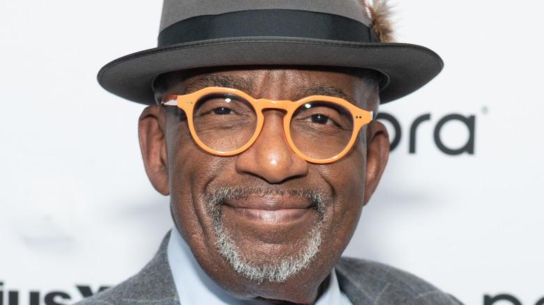 Al Roker posing, orange glasses