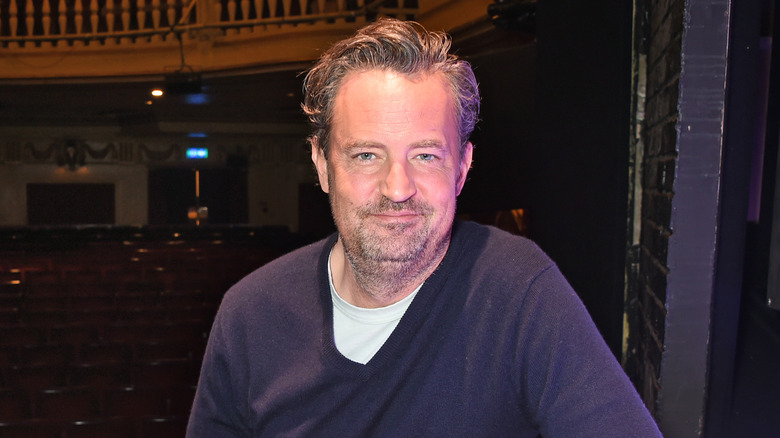 Matthew Perry poses at a photocall for "The End Of Longing