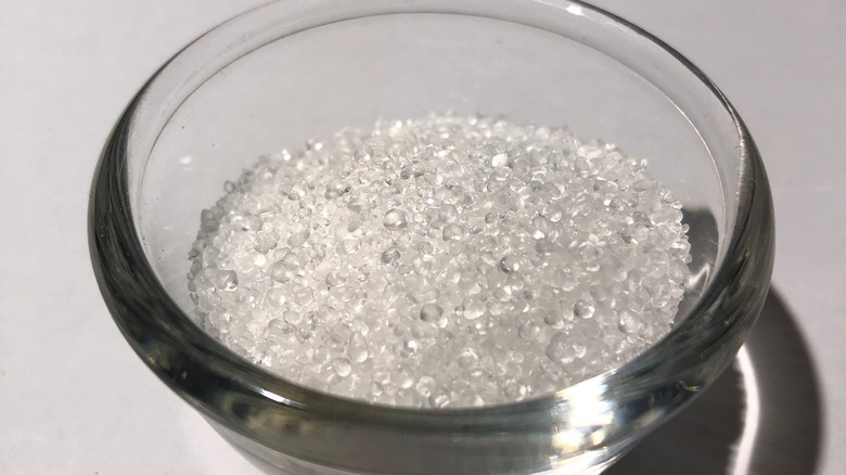 Pure, granulated BHT in glass bowl