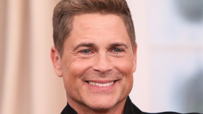 Rob Lowe smiles for the camera. 