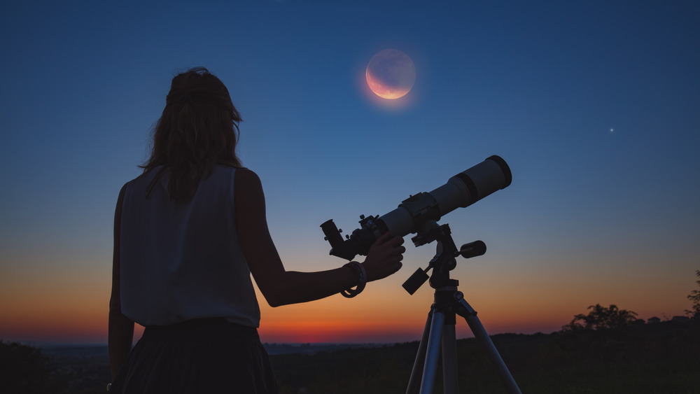 Woman looking at an eclipse