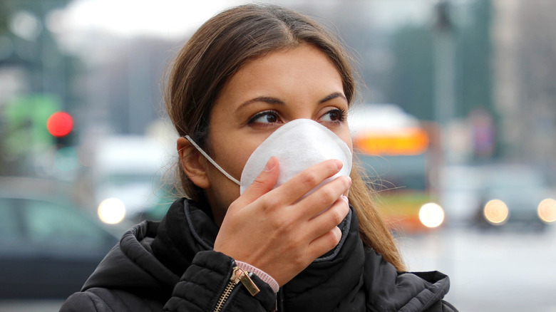 Woman outdoors in face mask