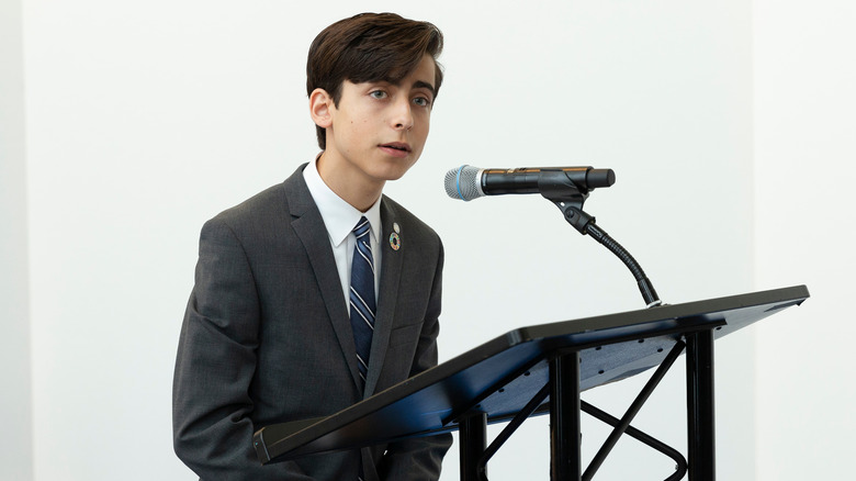 Aidan Gallagher speaking on climate change event