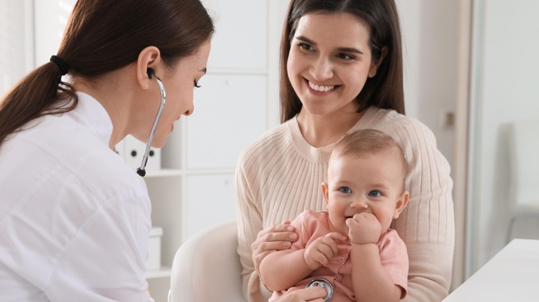 Baby visits doctor's office with mom 