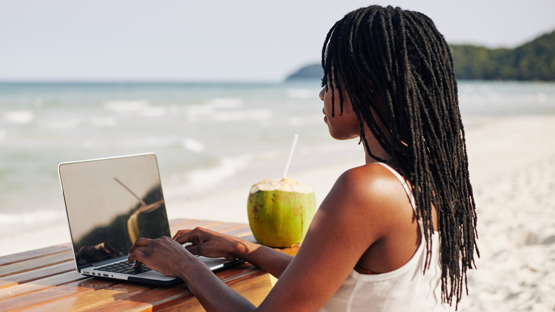 Woman with skinny dreadlocks