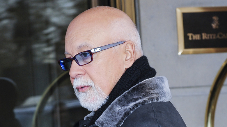 René Angélil wearing glasses