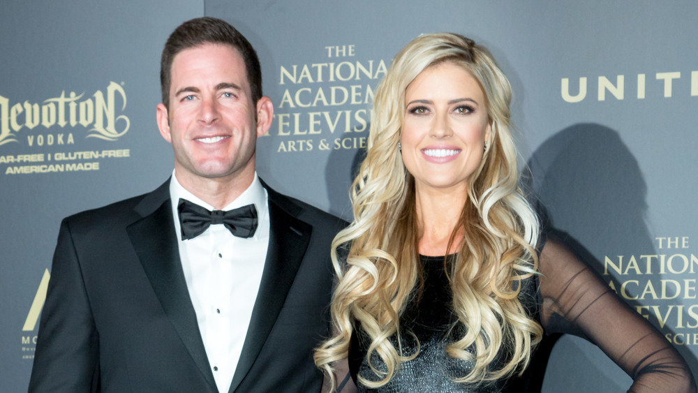 Christina Anstead and Tarek El Moussa in black tie attire