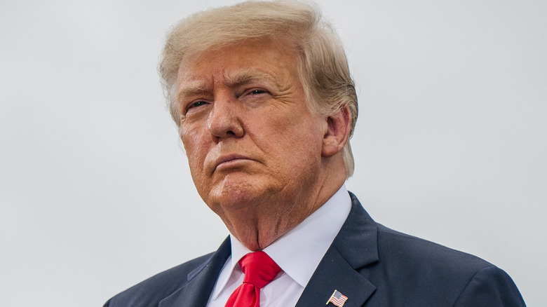 Trump wearing red, white, blue