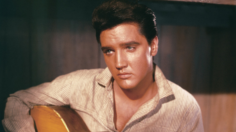 Elvis Presley playing guitar