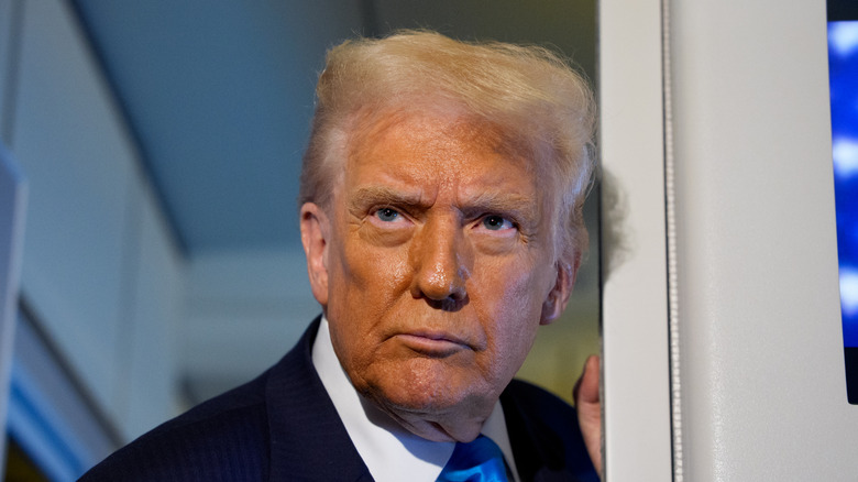 Donald Trump photographed standing in a doorway