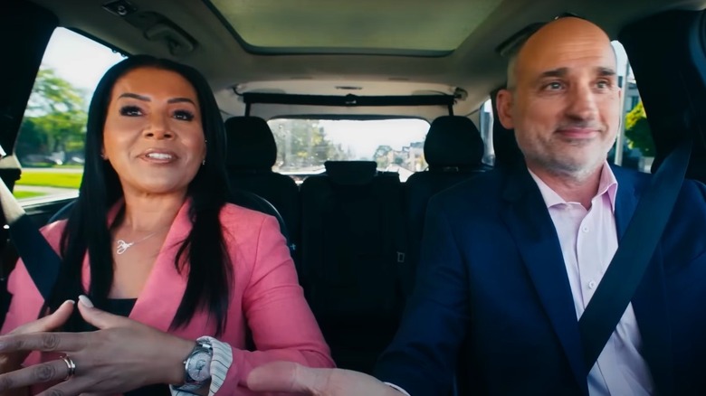 Page Turner and David Visentin in the front seats of a car in an episode of Love It or List It