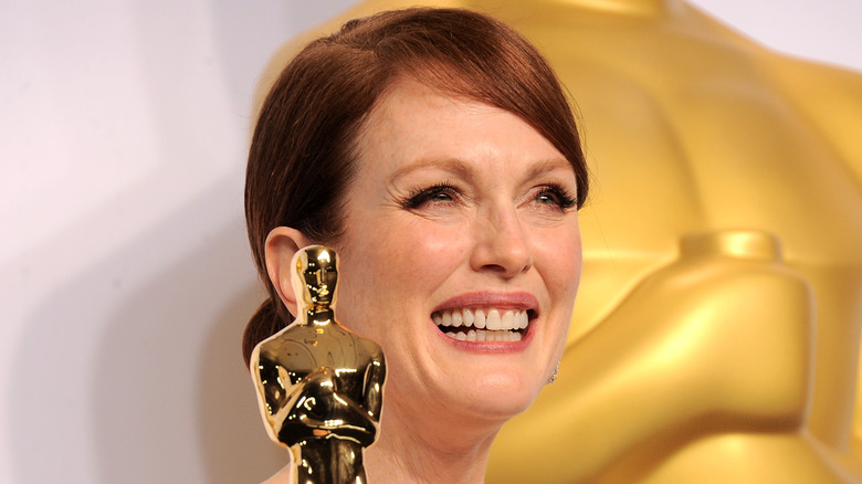 Julianne Moore holding her Oscar