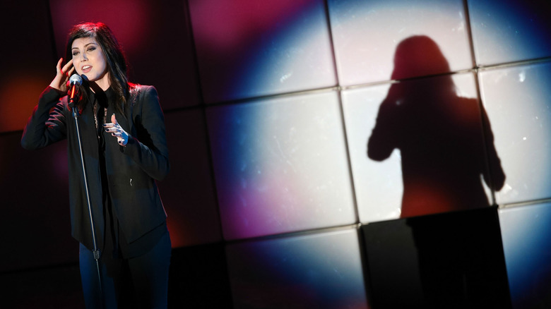 Briana Cuoco performing on stage in 2014