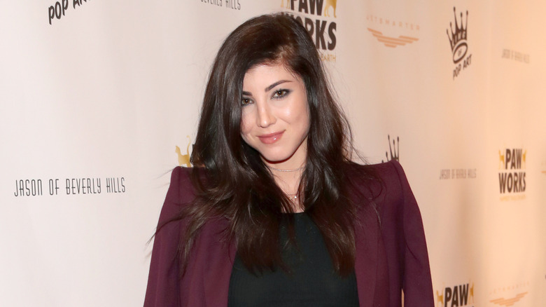 Briana Cuoco posing for a photo at an event in 2018