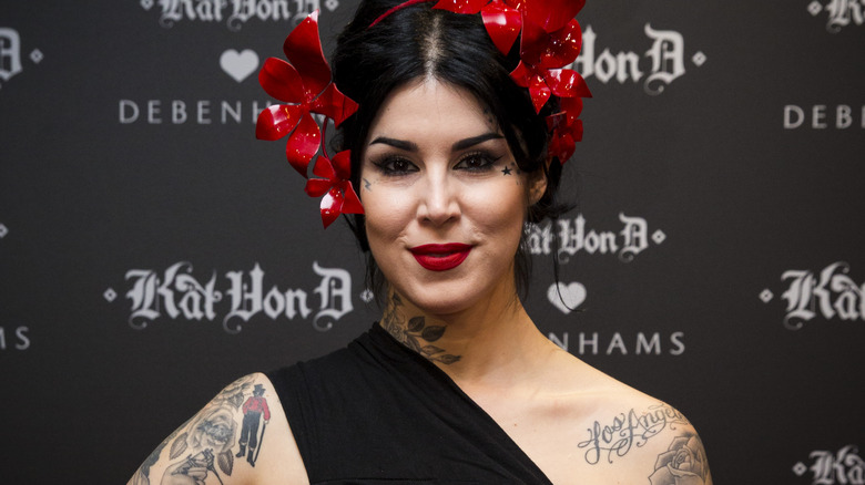Kat Von D posing with a headress