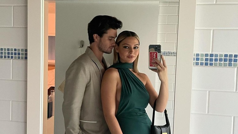 Madelyn Cline taking selfie with Chase Stokes 