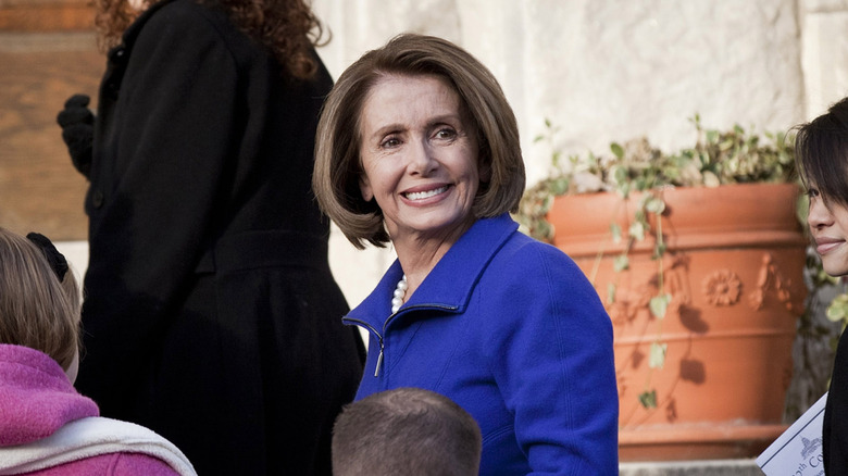 Nancy Pelosi wearing blue coat