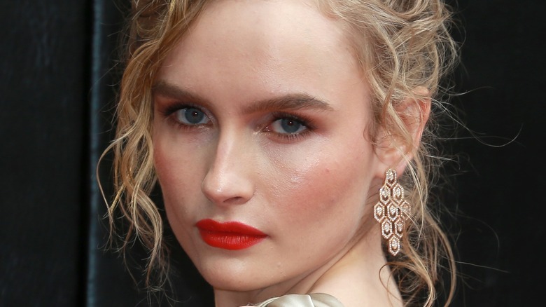 Olivia DeJonge with red lipstick