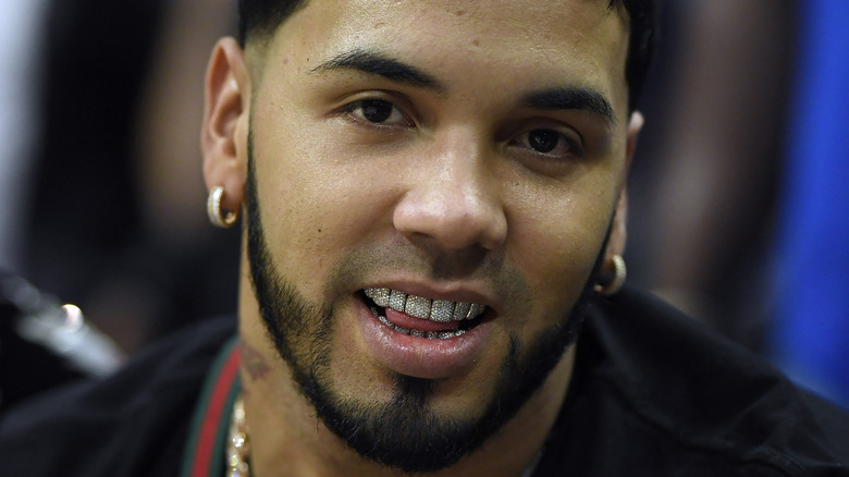 Singer Anuel AA sticking out his tongue