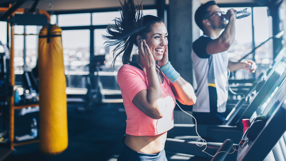 A smiling woman exercising 