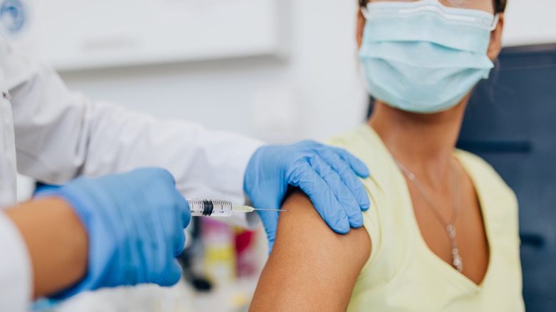 Woman getting COVID vaccine