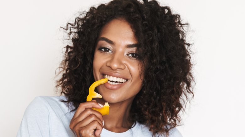 woman eating bell pepper