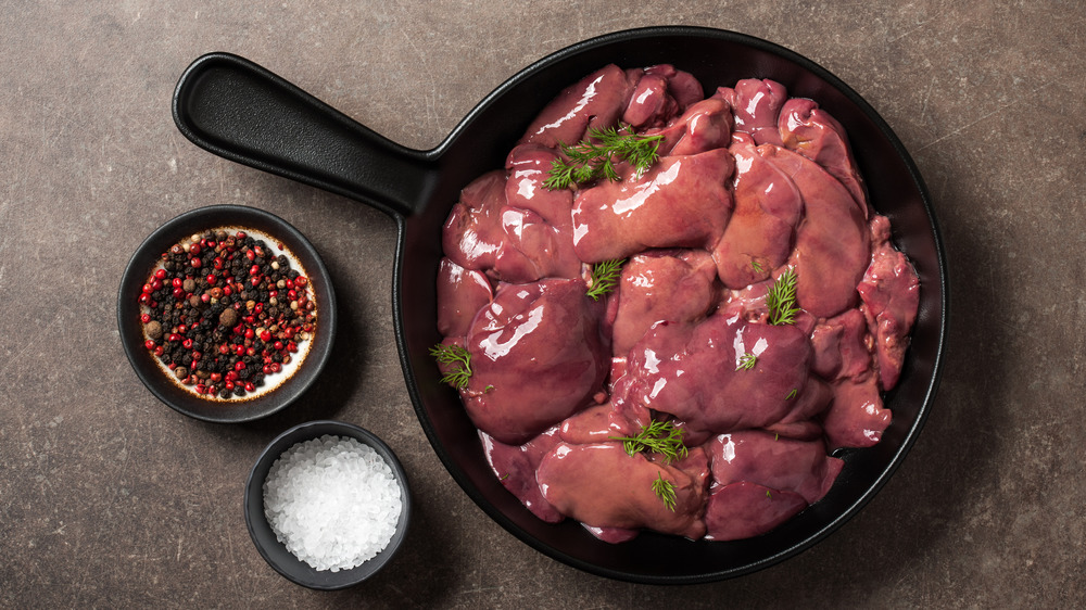 Raw chicken liver in a frying pan 
