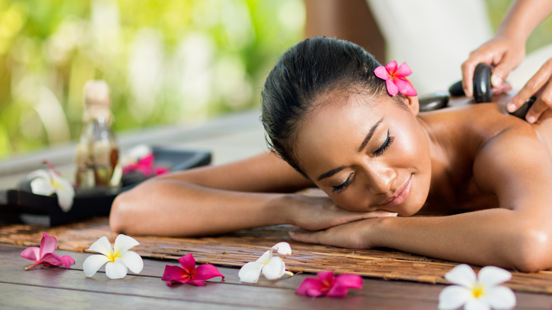 Woman getting hot stone massage