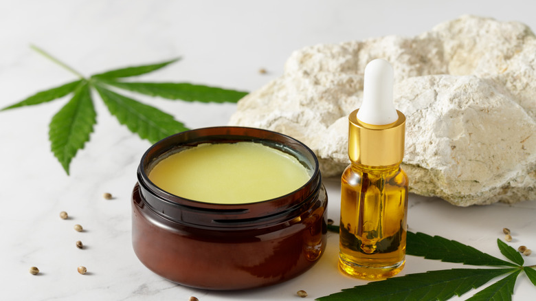 CBD oil bottle with marijuana leaves