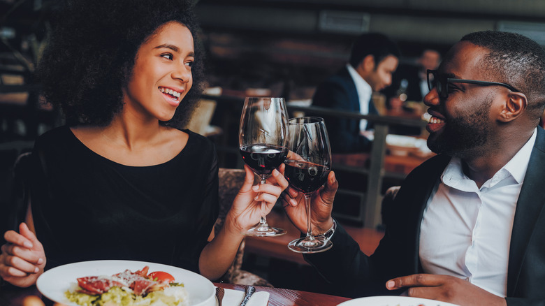 Couple smiling and dining together