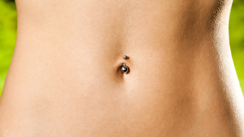 Abdomen with belly button piercing