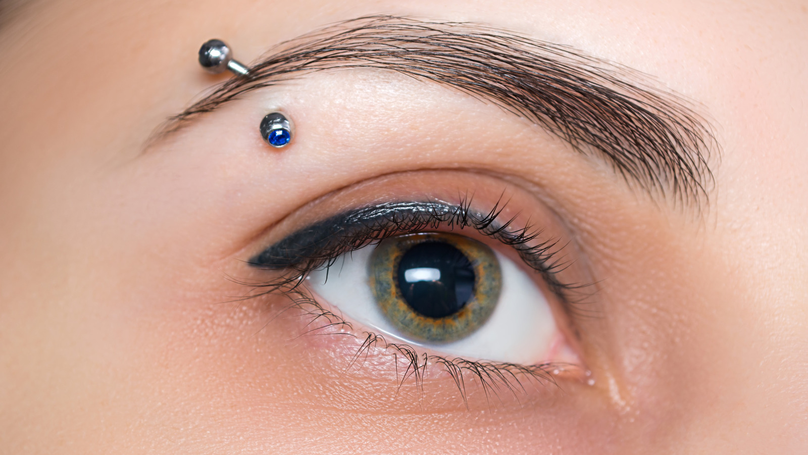 Close up image of eyebrow piercing
