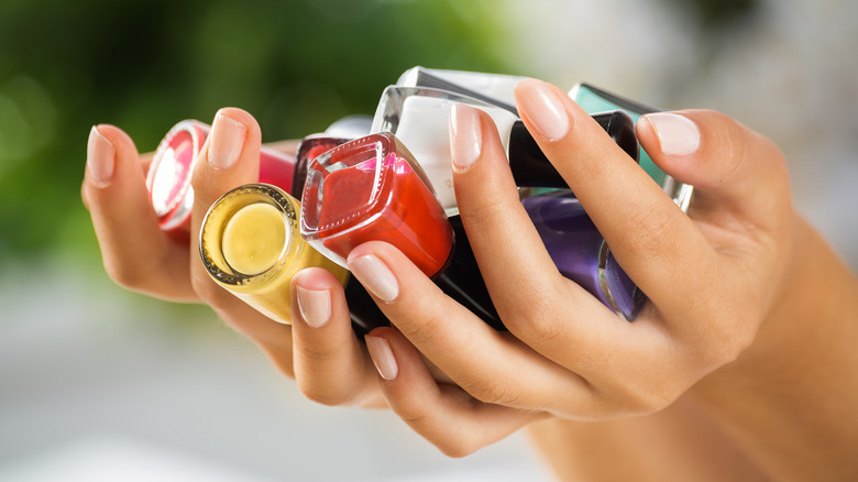 holding nail polishes