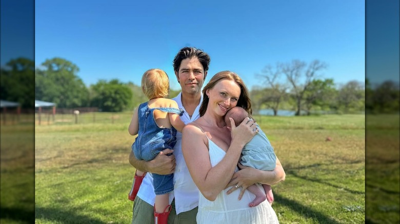 Adrian Grenier and ﻿Jordan Roemmele holding Seiko and Evren