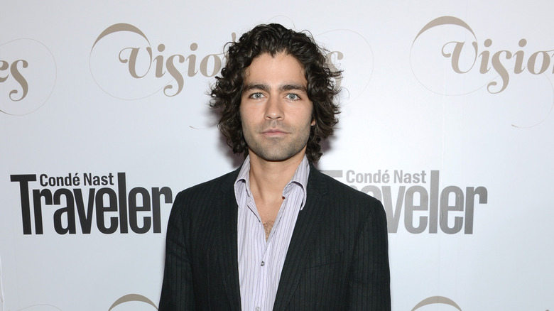 Adrian Grenier smiling at the Conde Nast Traveler celebration in 2012